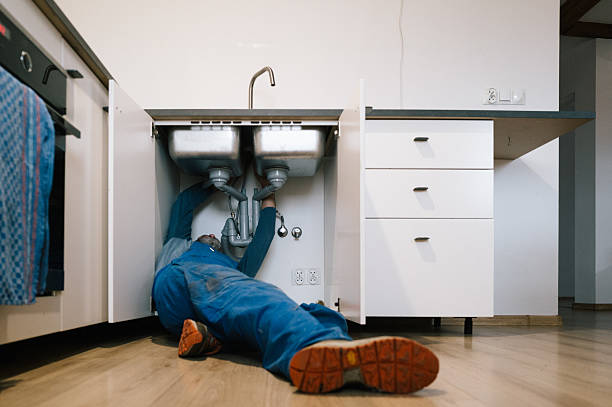 Professional Drain Cleaning technician working in Oxford, MA